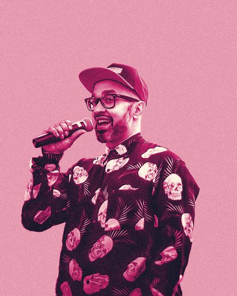 Ferdie Ahmed, founder of Barrio, on the mic in a cap and skull-print shirt